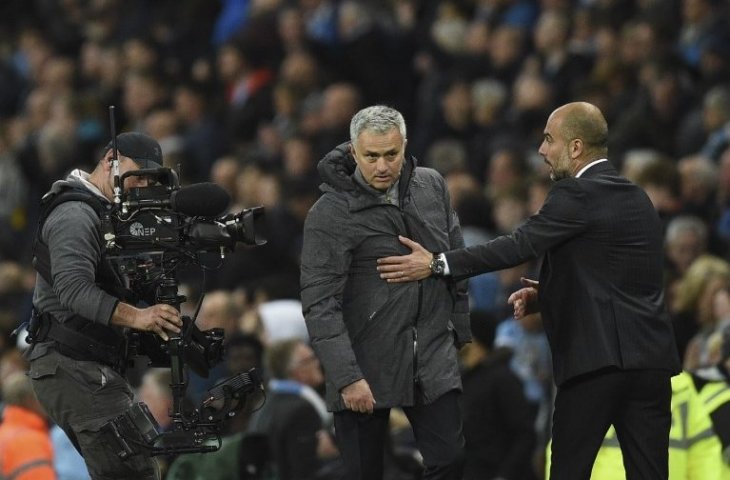 Jose Mourinho dan Pep Guardiola. (Oli Scarff/AFP).