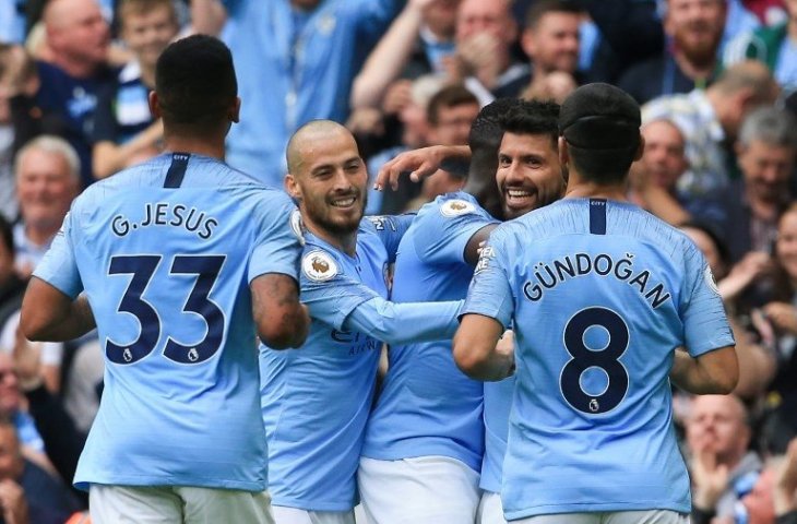 Para pemain Manchester City merayakan gol Sergio Aguero ke gawang Huddersfield Town (Lindsey Parnaby/AFP)