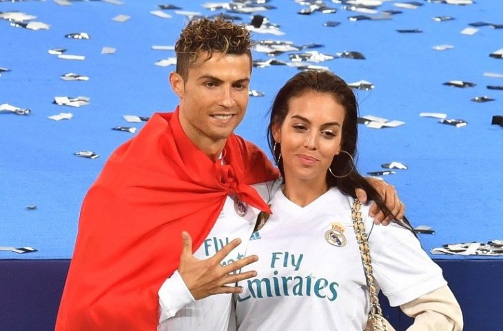 Cristiano Ronaldo dan Georgina Rodriguez saat Real Madrid berhasil memenangkan Liga Champions 2017/18 (Sergei Supinsky/AFP)