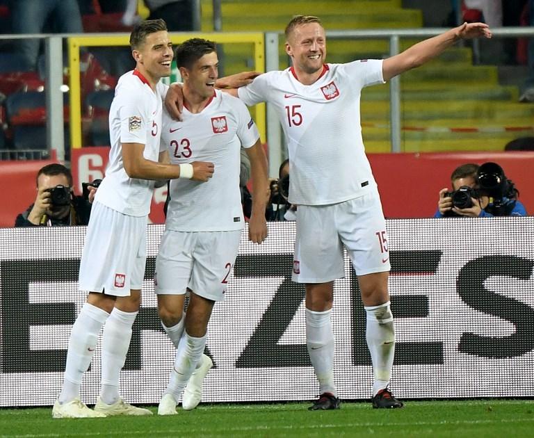 Krzysztof Piatek (tengah) saat merayakan gol ke gawang Portugal saat UEFA Nations League pada 11 Oktober 2018 (Janek Skarzynski/AFP)