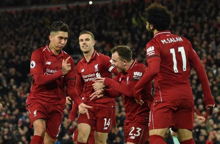 Para pemain Liverpool merayakan gol Roberto Firmino ke gawang Arsenal pada 29 Desember 2018. (Paul Ellis/AFP)