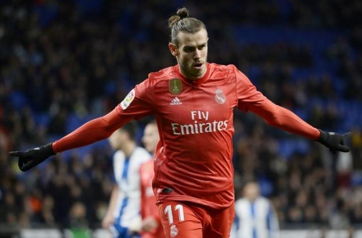 Penyerang Real Madrid, Gareth Bale sumbang satu gol untuk kemenangan 4-2 atas Espanyol di jornada ke-21 La Liga, Senin (28/1/2019) yang dihelat di RCDE Stadium. [JOSEP LAGO / AFP]