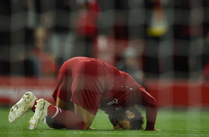 Selebrasi Mohamed Salah usai cetak gol ke gawang Huddersfield beberapa waktu lalu. [OLI SCARFF / AFP]