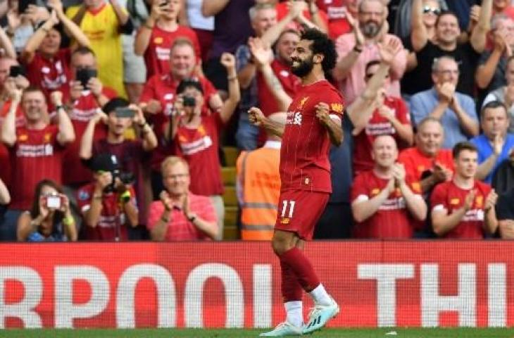 Selebrasi Mohamed Salah usai mencetak dua gol ke gawang Arsenal dalam lanjutan Liga Primer Inggris musim 2019/2020. (BEN STANSALL / AFP)