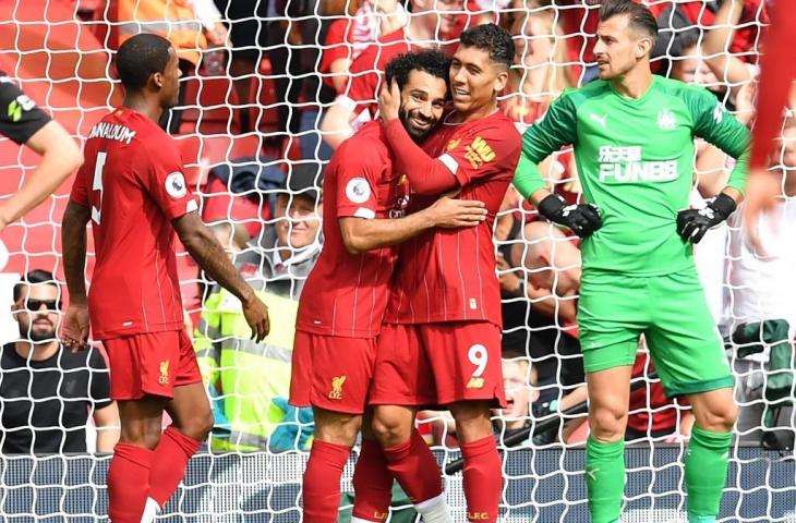 Selebrasi pemain Liverpool usai Mohamed Salah mencetak gol ke gawang Newcastle United, Sabtu (14/9/2019). [PAUL ELLIS / AFP]