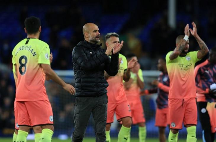 Ekspresi manajer Manchester City, Pep Guardiola usai timnya berhasil mengalahkan tuan rumah Everton, Sabtu (28/9/2019). Pada laga lanjutan pekan ketujuh Liga Primer Inggris tersebut, City sukses menang 3-1. [LINDSEY PARNABY / AFP]