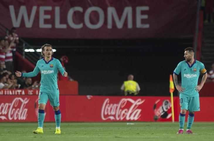 Antoine Griezmann dan Lionel Messi. [JORGE GUERRERO / AFP]