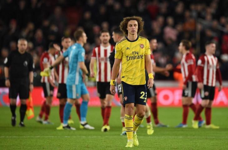 Ekspresi murung David Luiz usai Arsenal dipecundangi Sheffield United, Selasa 922/10/2019) dini hari tadi. [OLI SCARFF / AFP]