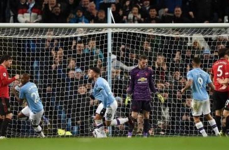 Aksi Nicolas Otamendi saat mencetak gol semata wayang Manchester City ke gawang Manchester United. (OLI SCARFF / AFP)