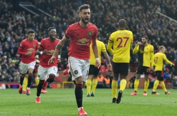 Selebrasi gelandang Manchester United, Bruno Fernandes usai cetak gol ke gawang Watford. (PAUL ELLIS / AFP)