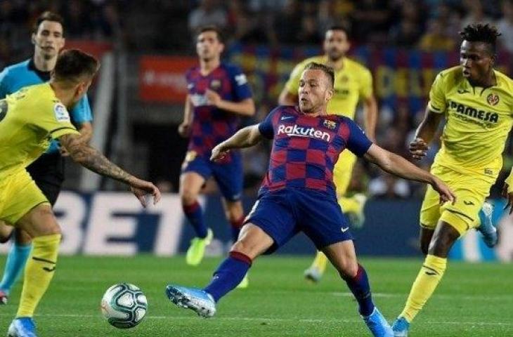 Gelandang Barcelona Arthur Melo mencetak gol kemenangan saat menjamu Villarreal di Camp Nou, Rabu (25/9/2019) dini hari WIB. (AFP)