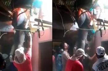 Ngeri! Viral Atlet Gantole PON Papua Nyangkut di Genting Rumah Warga