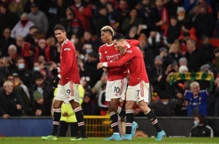 Potret pemain Manchester United, Marcus Rashford, Cristiano Ronaldo, dan Raphael Varane. (OLI SCARFF / AFP)