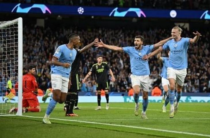 Pemain Manchester City melakukan selenrasi usai bobol gawang Real Madrid. (AFP)