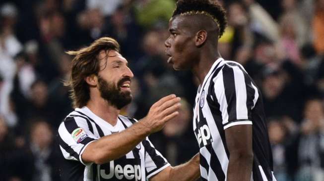 Andre Pirlo saat masih bersama bermain bersama Paul Pogba di Juventus Paul Pogba. AFP PHOTO / GIUSEPPE CACACE