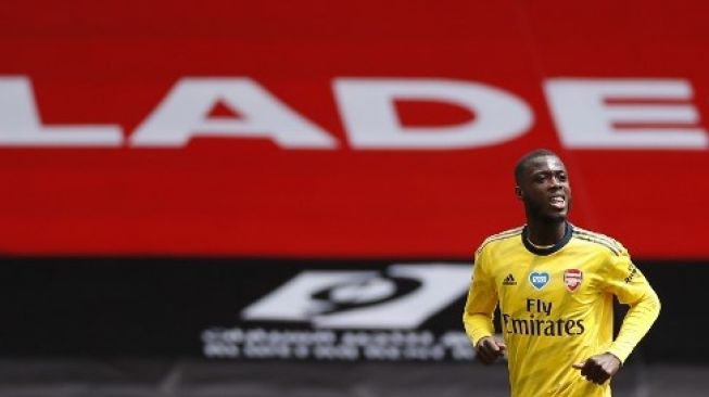 Gelandang Arsenal Nicolas Pepe merayakan golnya ke gawang Sheffield United dalam laga perempat final Piala FA di Bramall Lane. ANDREW BOYERS / POOL / AFP